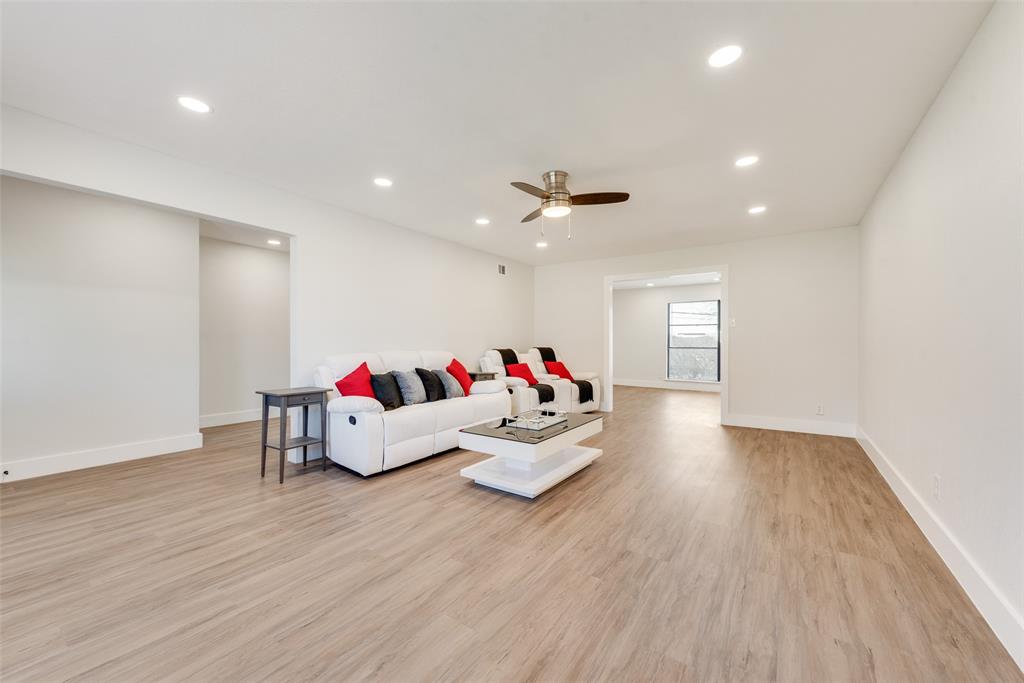 5311 Rocky Ridge Road Dallas, TX 75241 - Photo 7 of 24 a living room with furniture and a wooden floor
