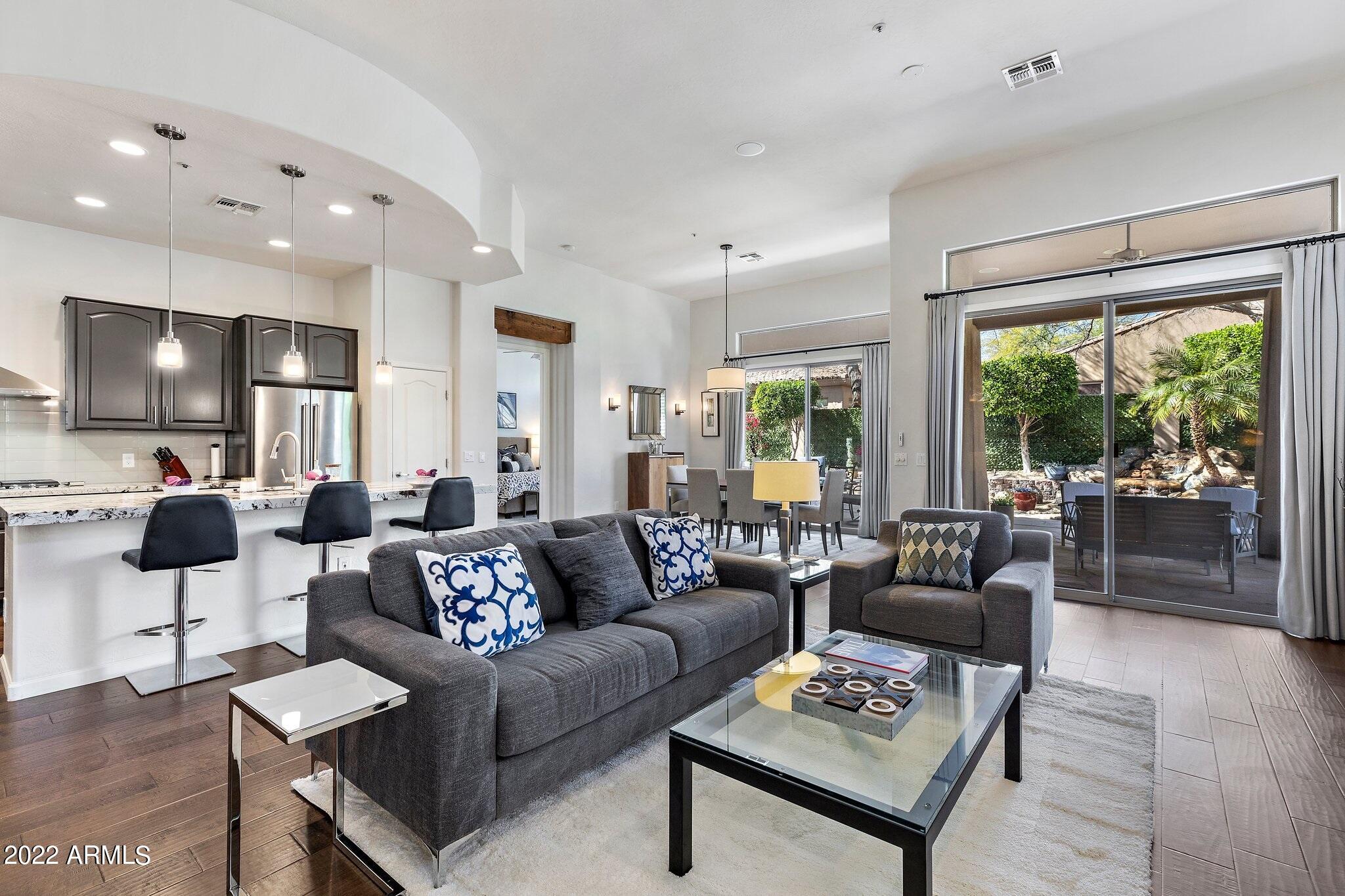 8184 East Beardsley Road Scottsdale, AZ 85255 - Photo 12 of 39 a living room with furniture and a flat screen tv