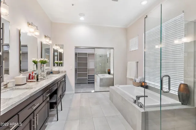 a large bathroom with a large tub and sink