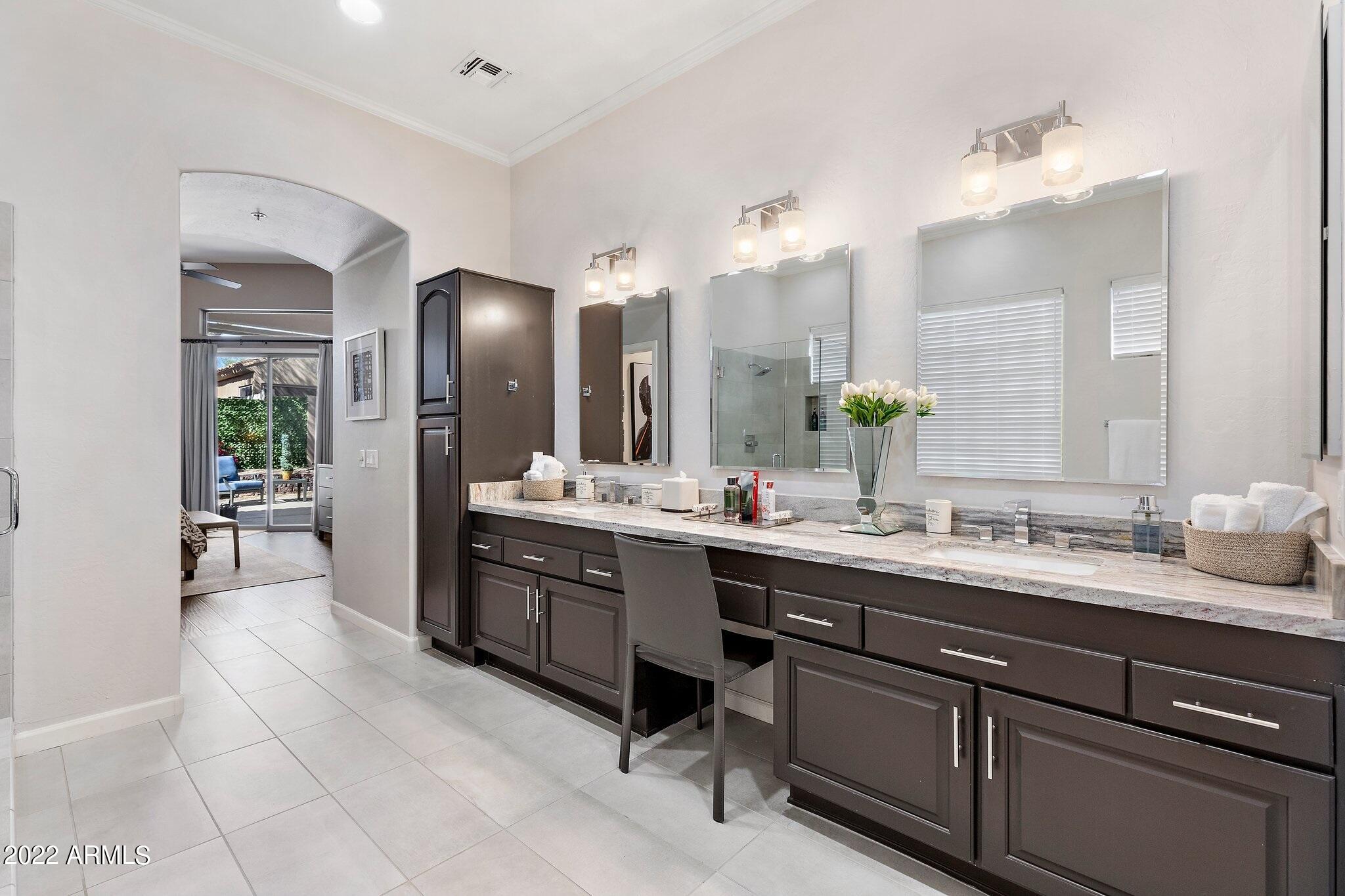 8184 East Beardsley Road Scottsdale, AZ 85255 - Photo 19 of 39 a large bathroom with a double vanity sink a mirror and a shower