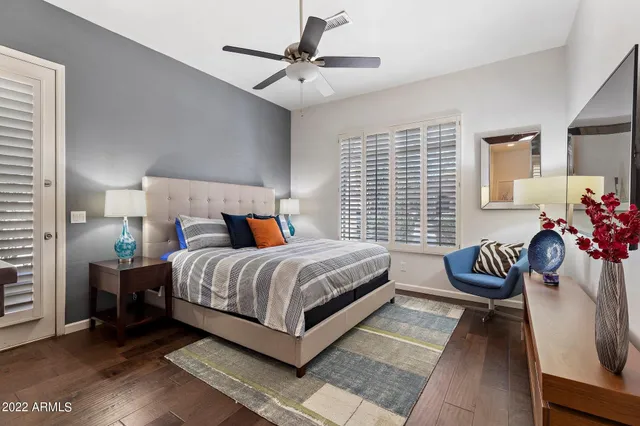 a bedroom with a bed and a couch