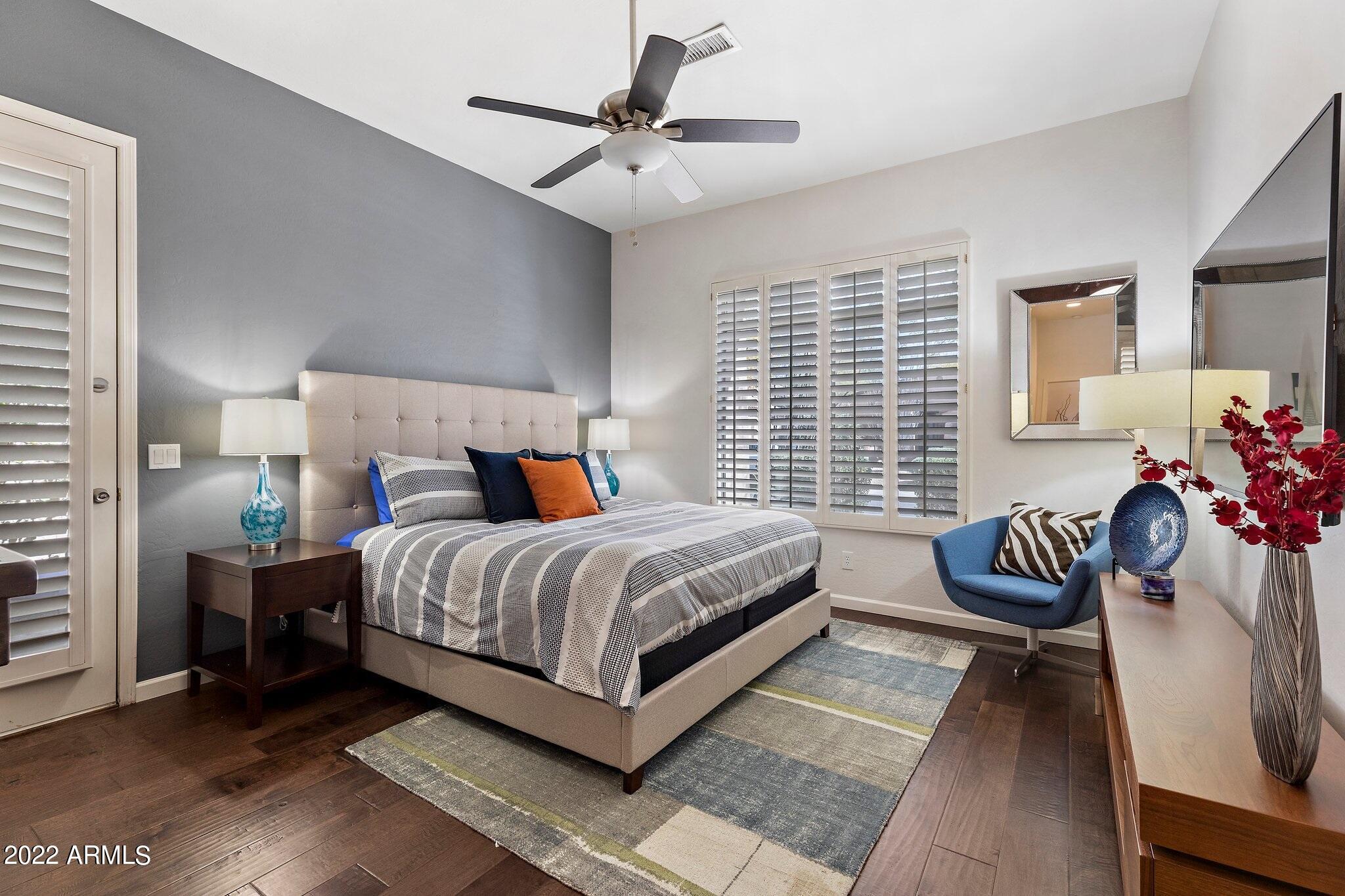 8184 East Beardsley Road Scottsdale, AZ 85255 - Photo 23 of 39 a bedroom with a bed and a couch