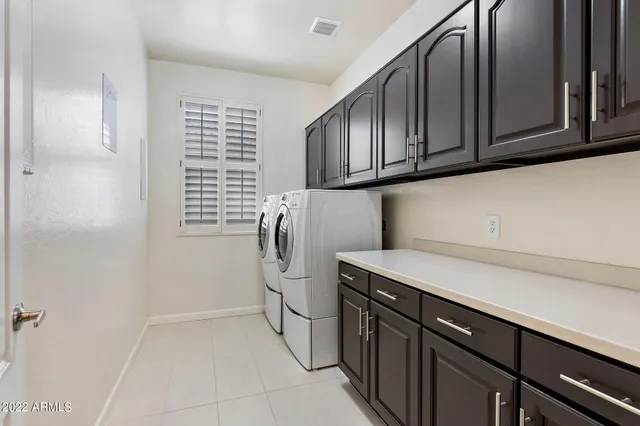 a utility room with cabinets