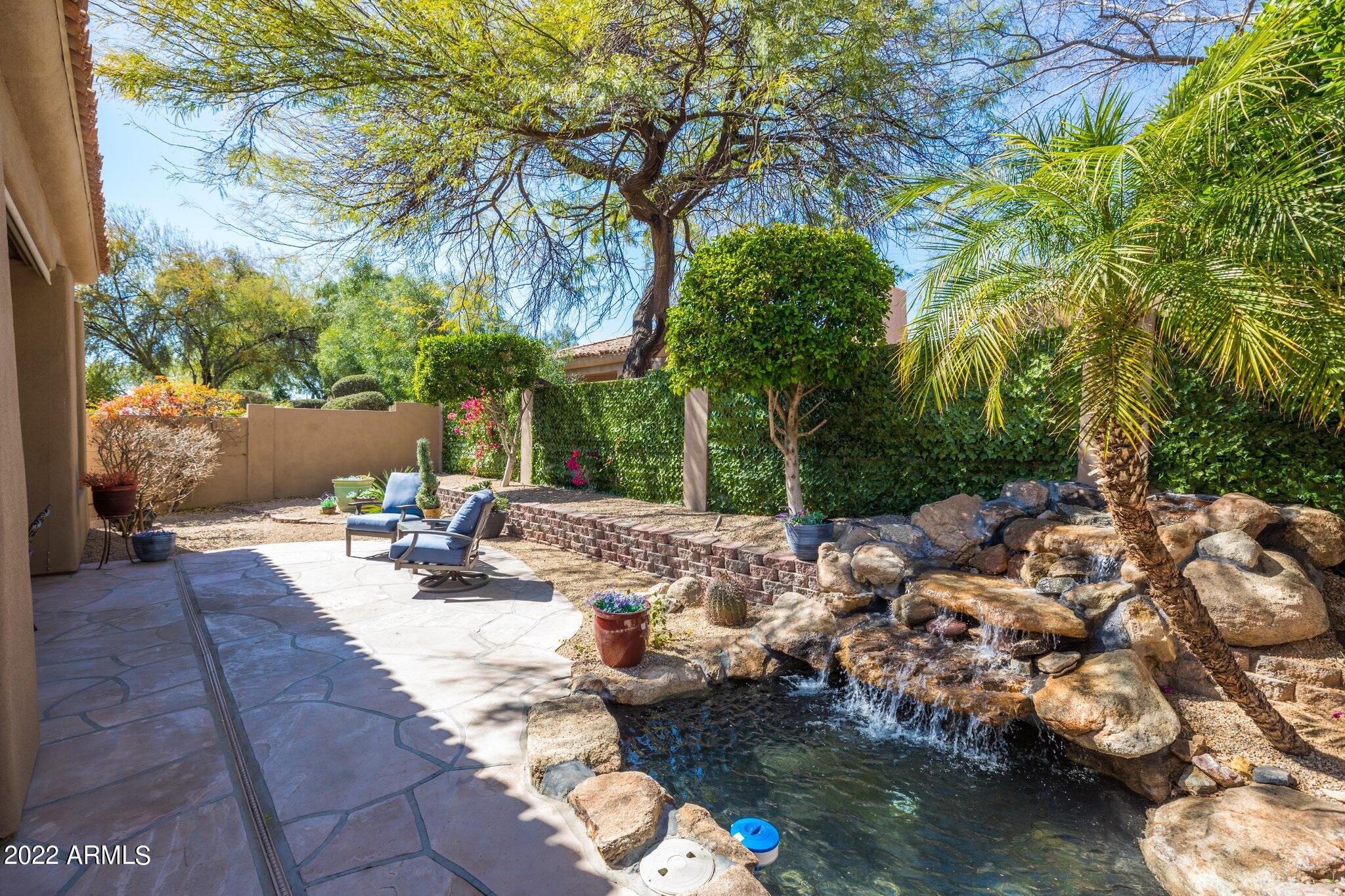 8184 East Beardsley Road Scottsdale, AZ 85255 - Photo 31 of 39 a view of a backyard of a house