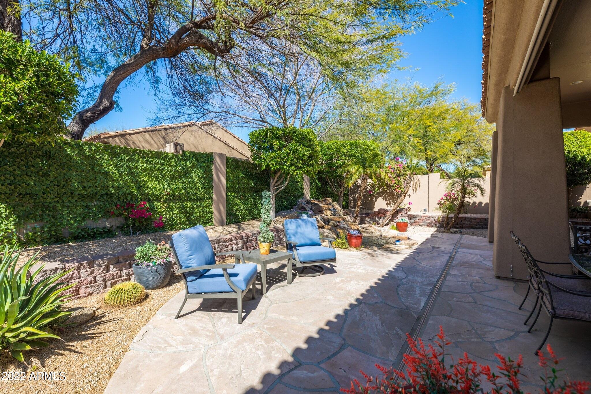 8184 East Beardsley Road Scottsdale, AZ 85255 - Photo 33 of 39 a view of backyard with outdoor seating and trees