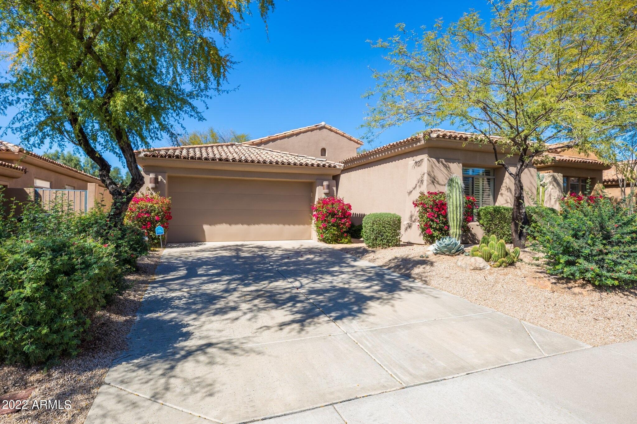 8184 East Beardsley Road Scottsdale, AZ 85255 - Photo 39 of 39 a front view of a house with a garage