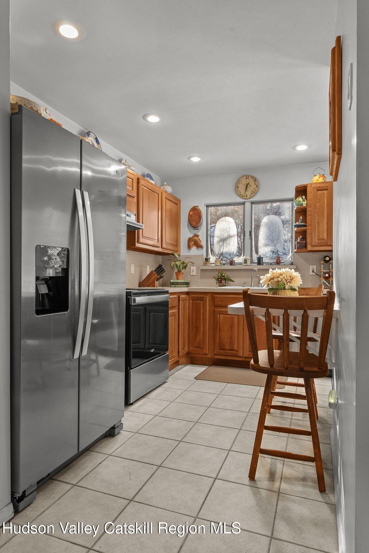 107 Ox Road Roxbury, NY 12421 - Photo 13 of 30 a kitchen with stainless steel appliances granite countertop a sink stove and refrigerator