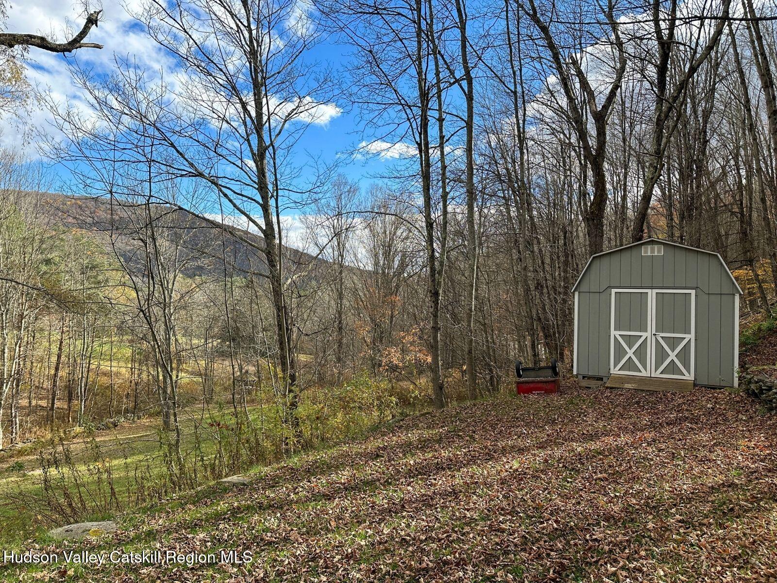 107 Ox Road Roxbury, NY 12421 - Photo 26 of 30 a front view of a house with a yard