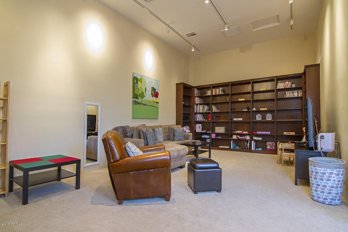 4805 East Pebble Ridge Road Paradise Valley, AZ 85253 - Photo 11 of 37 a living room with furniture and a couch