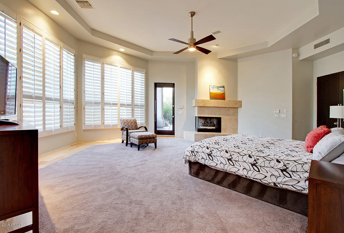 4805 East Pebble Ridge Road Paradise Valley, AZ 85253 - Photo 12 of 37 a living room with furniture and a fireplace