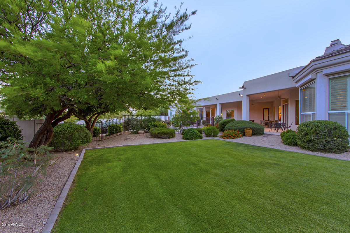4805 East Pebble Ridge Road Paradise Valley, AZ 85253 - Photo 16 of 37 a front view of a house with a yard