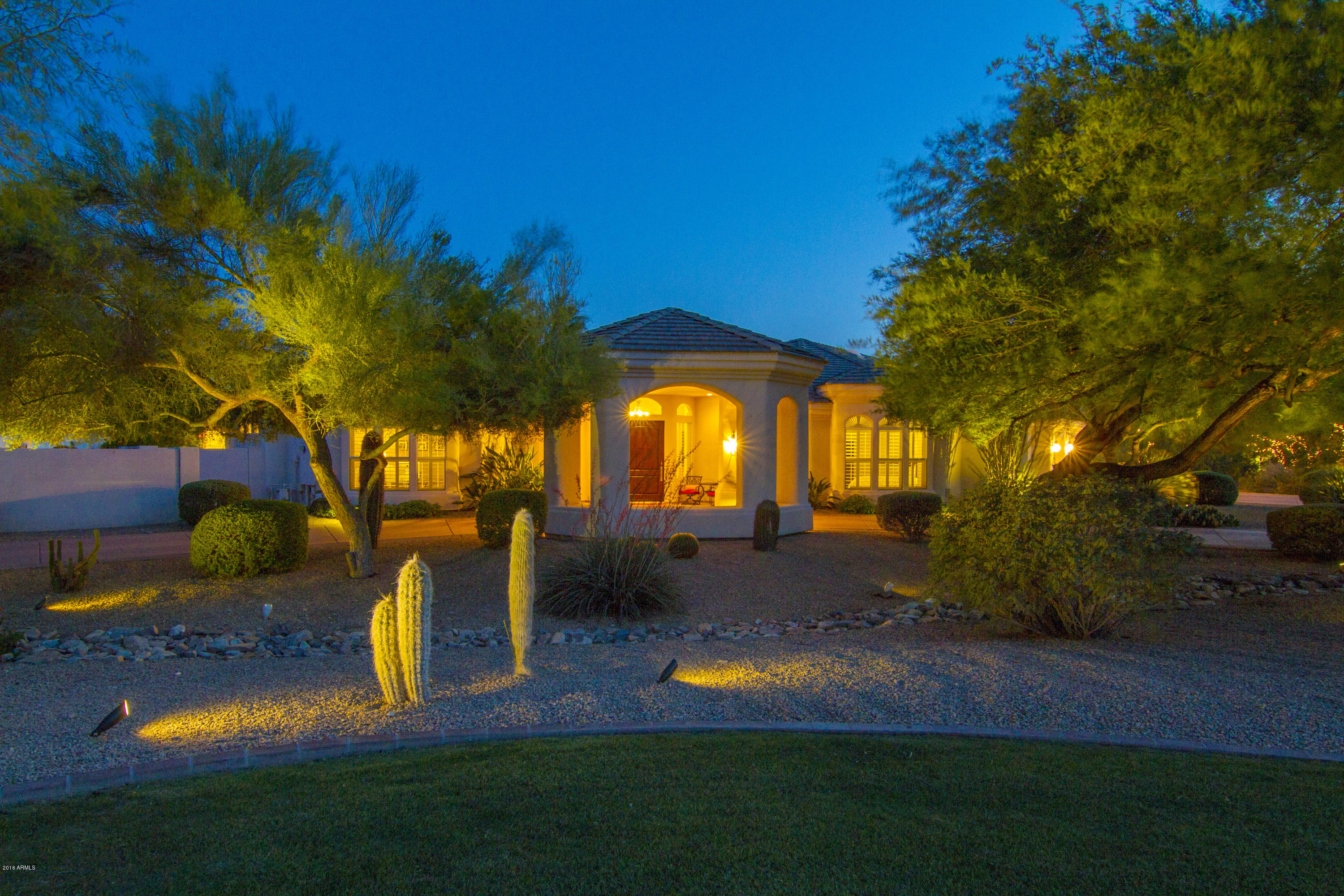 4805 East Pebble Ridge Road Paradise Valley, AZ 85253 - Photo 18 of 37 a view of a house with swimming pool and sitting area
