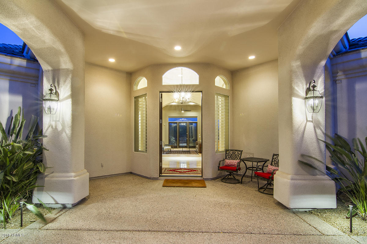 4805 East Pebble Ridge Road Paradise Valley, AZ 85253 - Photo 20 of 37 a view of a livingroom with furniture and a potted plant