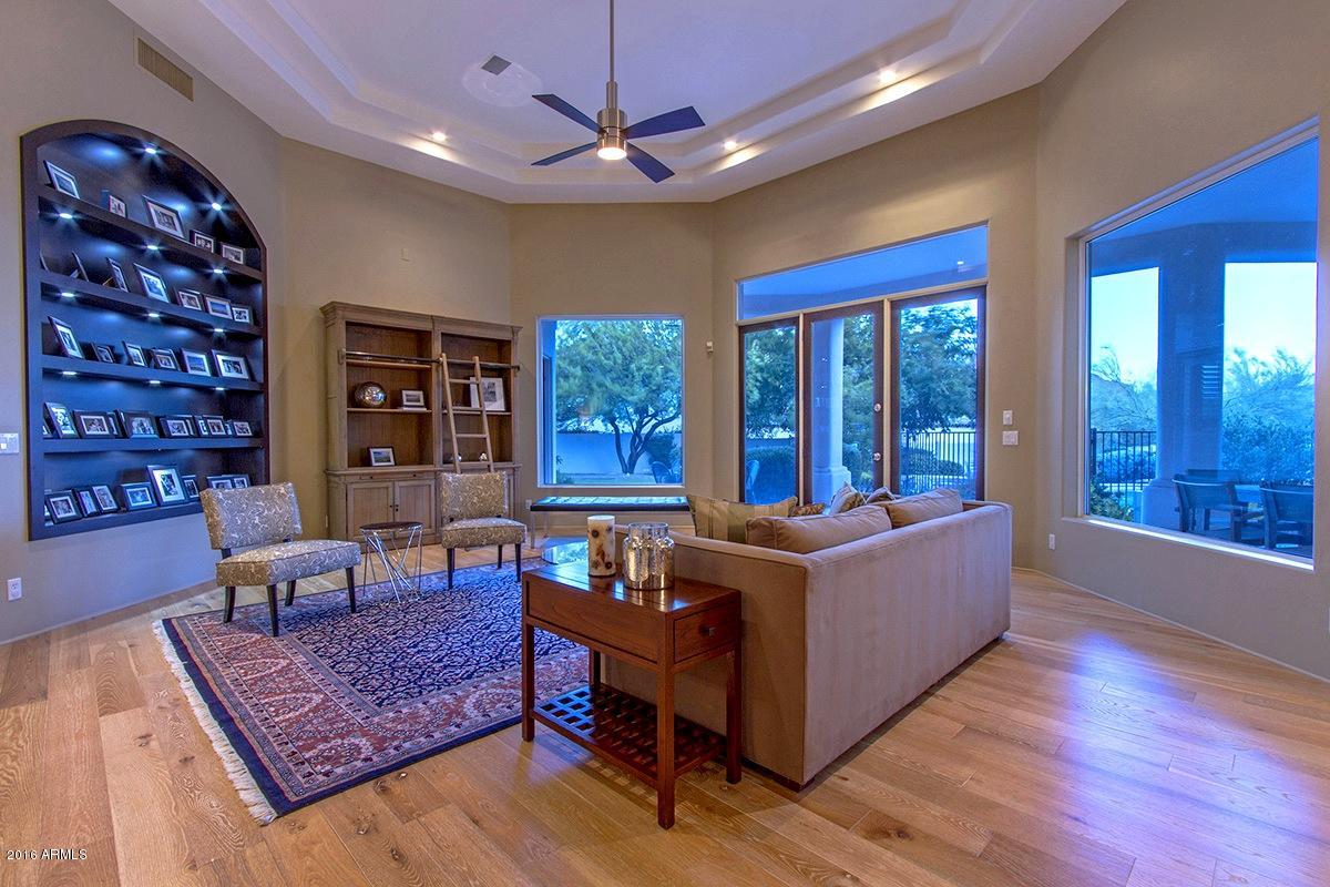 4805 East Pebble Ridge Road Paradise Valley, AZ 85253 - Photo 21 of 37 a living room with furniture and a rug