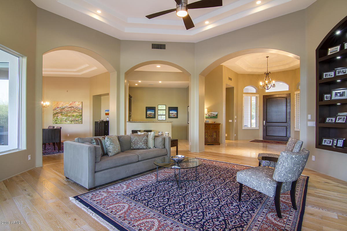 4805 East Pebble Ridge Road Paradise Valley, AZ 85253 - Photo 22 of 37 a living room with furniture and a wooden floor