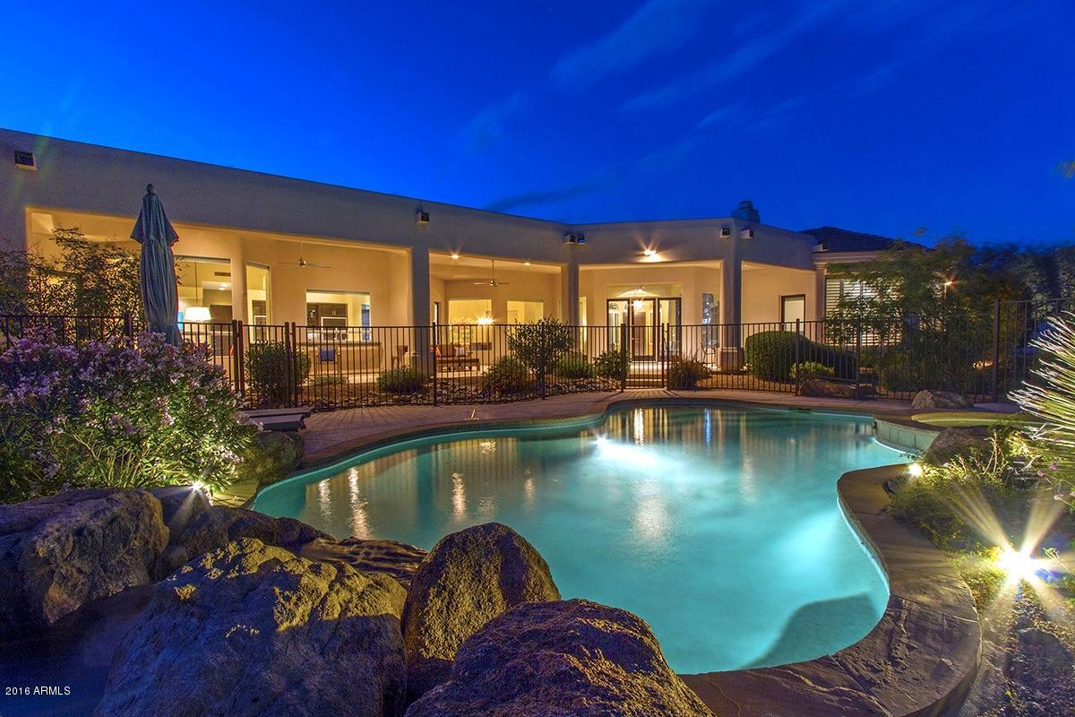 4805 East Pebble Ridge Road Paradise Valley, AZ 85253 - Photo 3 of 37 a view of a swimming pool with outdoor seating