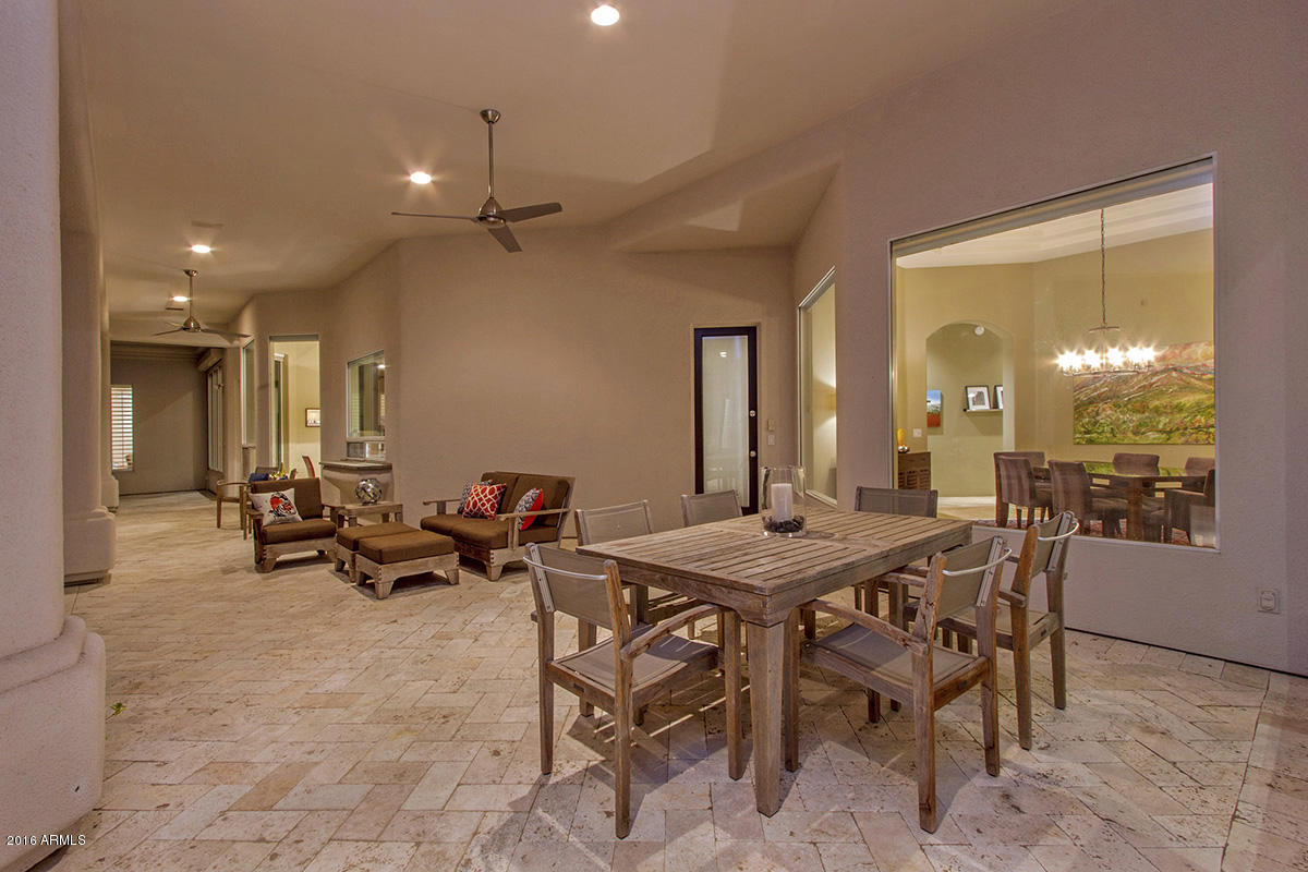 4805 East Pebble Ridge Road Paradise Valley, AZ 85253 - Photo 32 of 37 a dinning area with furniture and a potted plant
