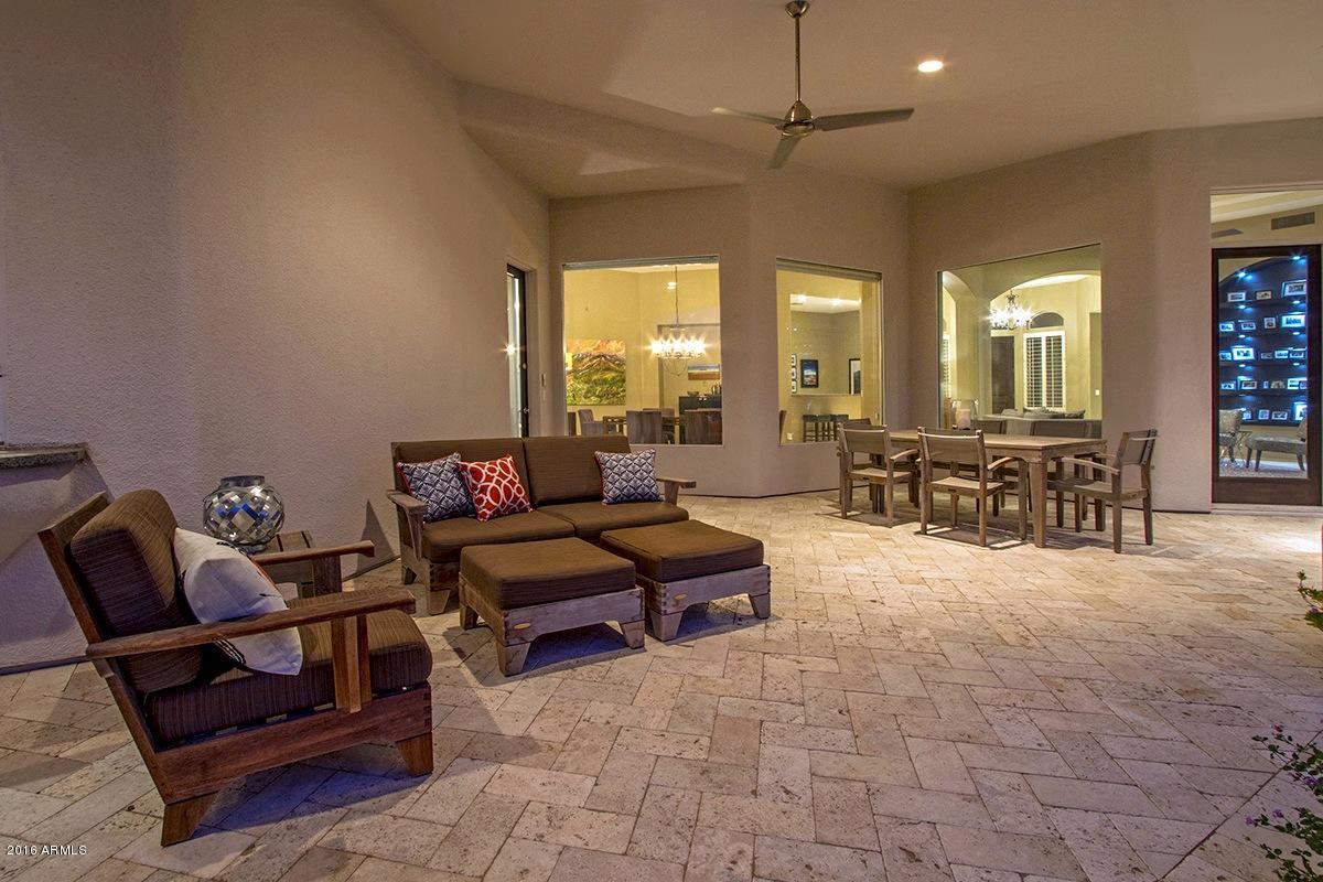 4805 East Pebble Ridge Road Paradise Valley, AZ 85253 - Photo 34 of 37 a living room with furniture and a flat screen tv