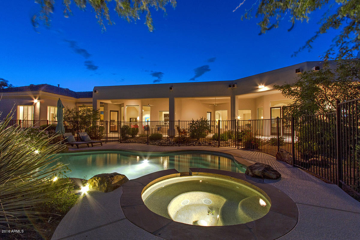 4805 East Pebble Ridge Road Paradise Valley, AZ 85253 - Photo 36 of 37 a view of a swimming pool with chair and tables