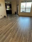 1425 West Villa Maria Road, Unit 602 Bryan, TX 77801 - Photo 11 of 12 a view of a room with wooden floor and windows