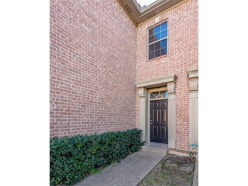 1425 West Villa Maria Road, Unit 602 Bryan, TX 77801 - Photo 2 of 12 a view of a brick house with a small space