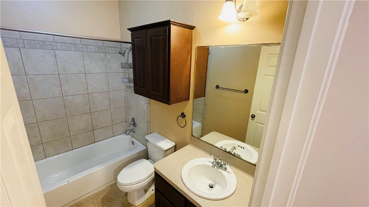 1425 West Villa Maria Road, Unit 602 Bryan, TX 77801 - Photo 26 of 41 a bathroom with a sink toilet and shower