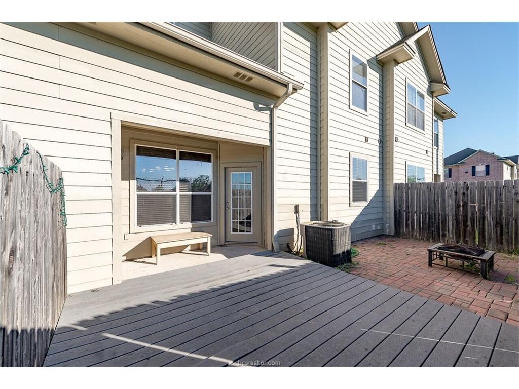 1425 West Villa Maria Road, Unit 602 Bryan, TX 77801 - Photo 3 of 12 a backyard of a house with seating space