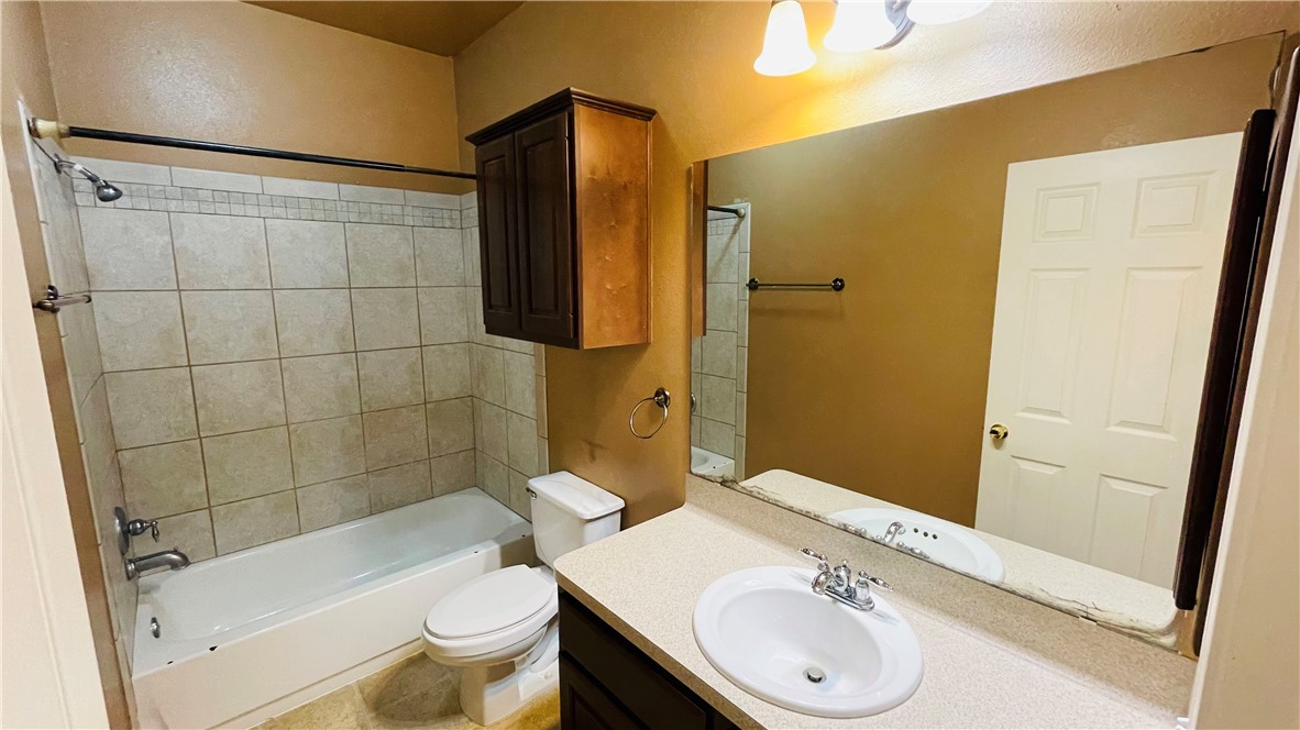 1425 West Villa Maria Road, Unit 602 Bryan, TX 77801 - Photo 35 of 41 a bathroom with a sink a toilet and shower
