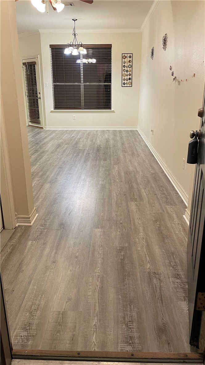 1425 West Villa Maria Road, Unit 602 Bryan, TX 77801 - Photo 4 of 41 a view of empty room with wooden floor