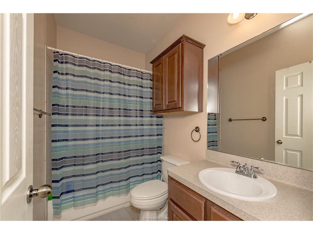 1425 West Villa Maria Road, Unit 602 Bryan, TX 77801 - Photo 6 of 12 a bathroom with a sink toilet and shower