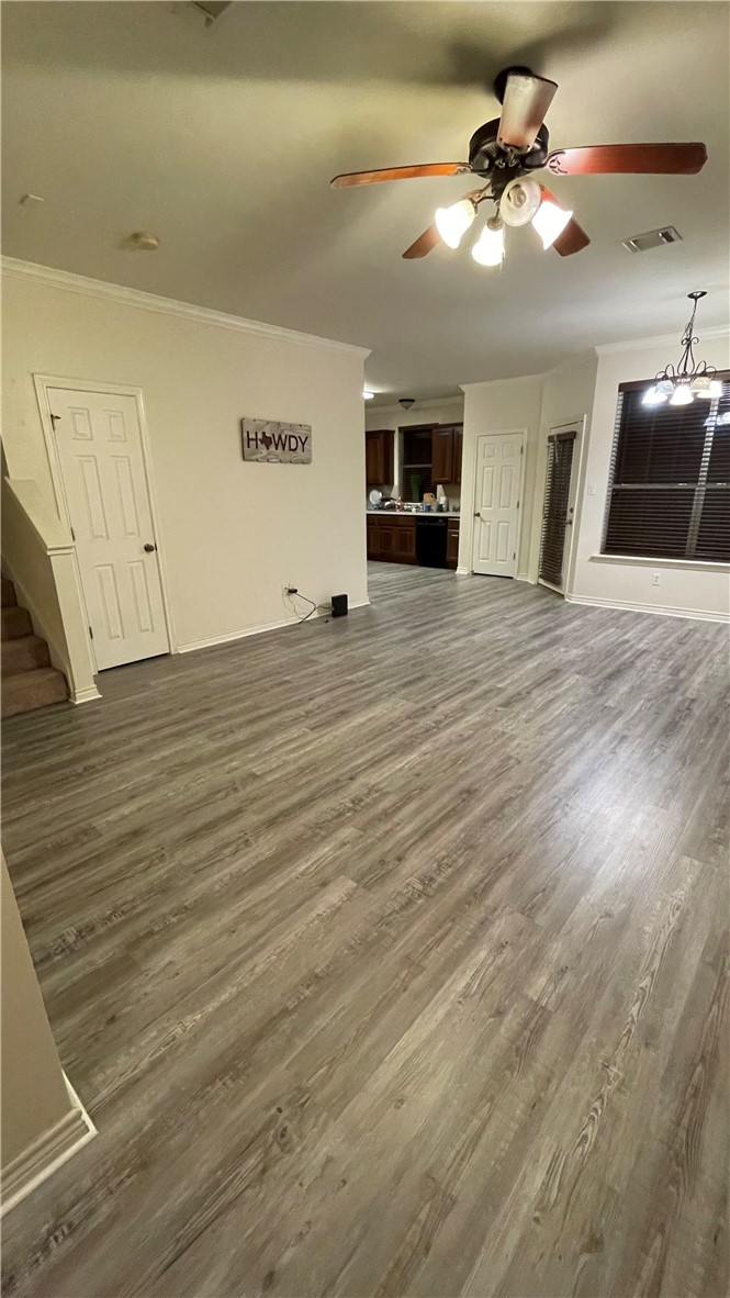 1425 West Villa Maria Road, Unit 602 Bryan, TX 77801 - Photo 6 of 41 a view of a livingroom with a ceiling fan wooden floor and a ceiling fan