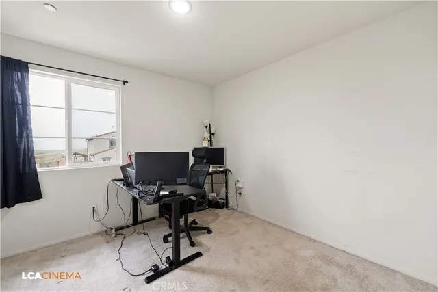 a bedroom with a bed and dresser