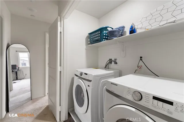 a bedroom with a bed and a television