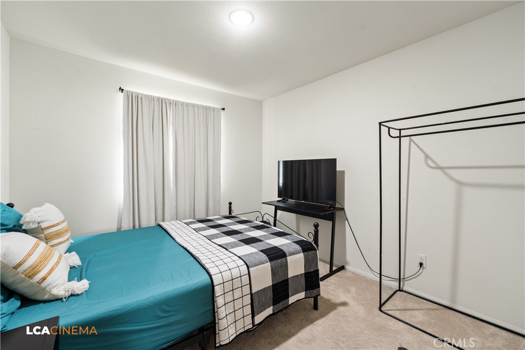 11112 Pasto Way Bakersfield, CA 93306 - Photo 18 of 35 a bedroom with a bed and a television
