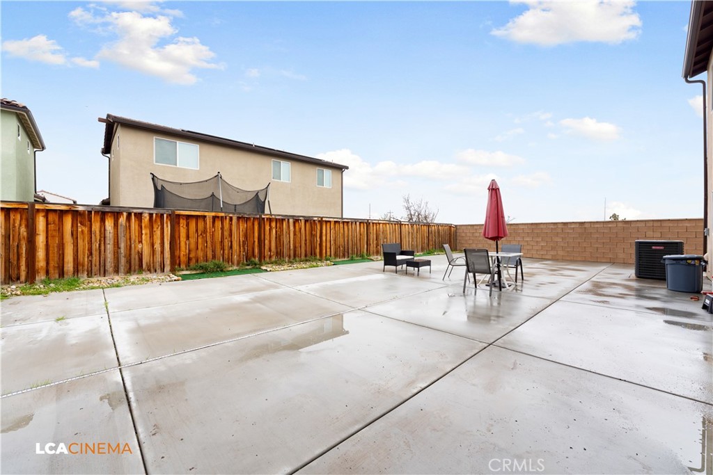 11112 Pasto Way Bakersfield, CA 93306 - Photo 23 of 35 a view of a patio with a table and chairs