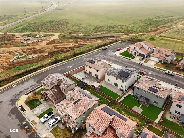 a view of swimming pool with outdoor seating and yard in the back