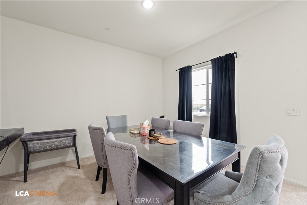 11112 Pasto Way Bakersfield, CA 93306 - Photo 7 of 35 a view of a dining room with furniture and window