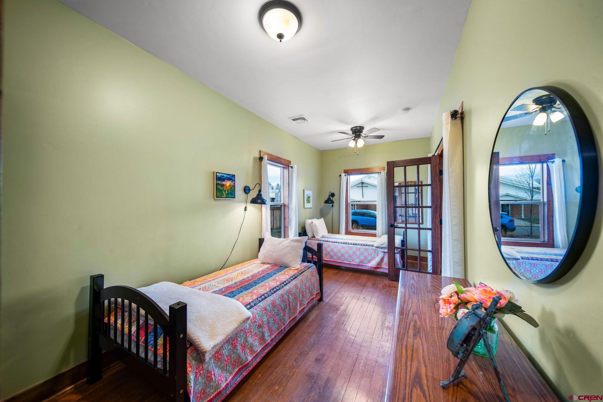 115 South Linden Street Cortez, CO 81321 - Photo 11 of 30 a bedroom with bed and a potted plant