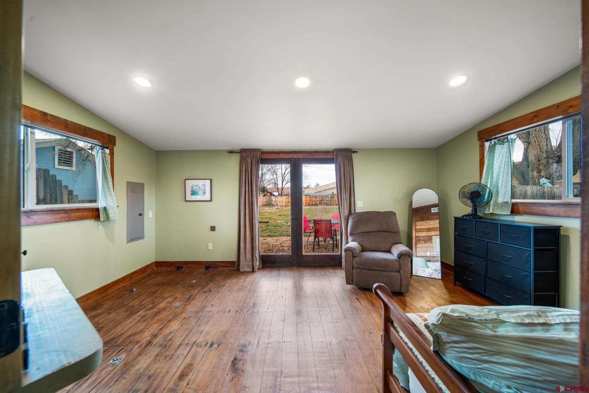 115 South Linden Street Cortez, CO 81321 - Photo 18 of 30 a living room with furniture and a wooden floor