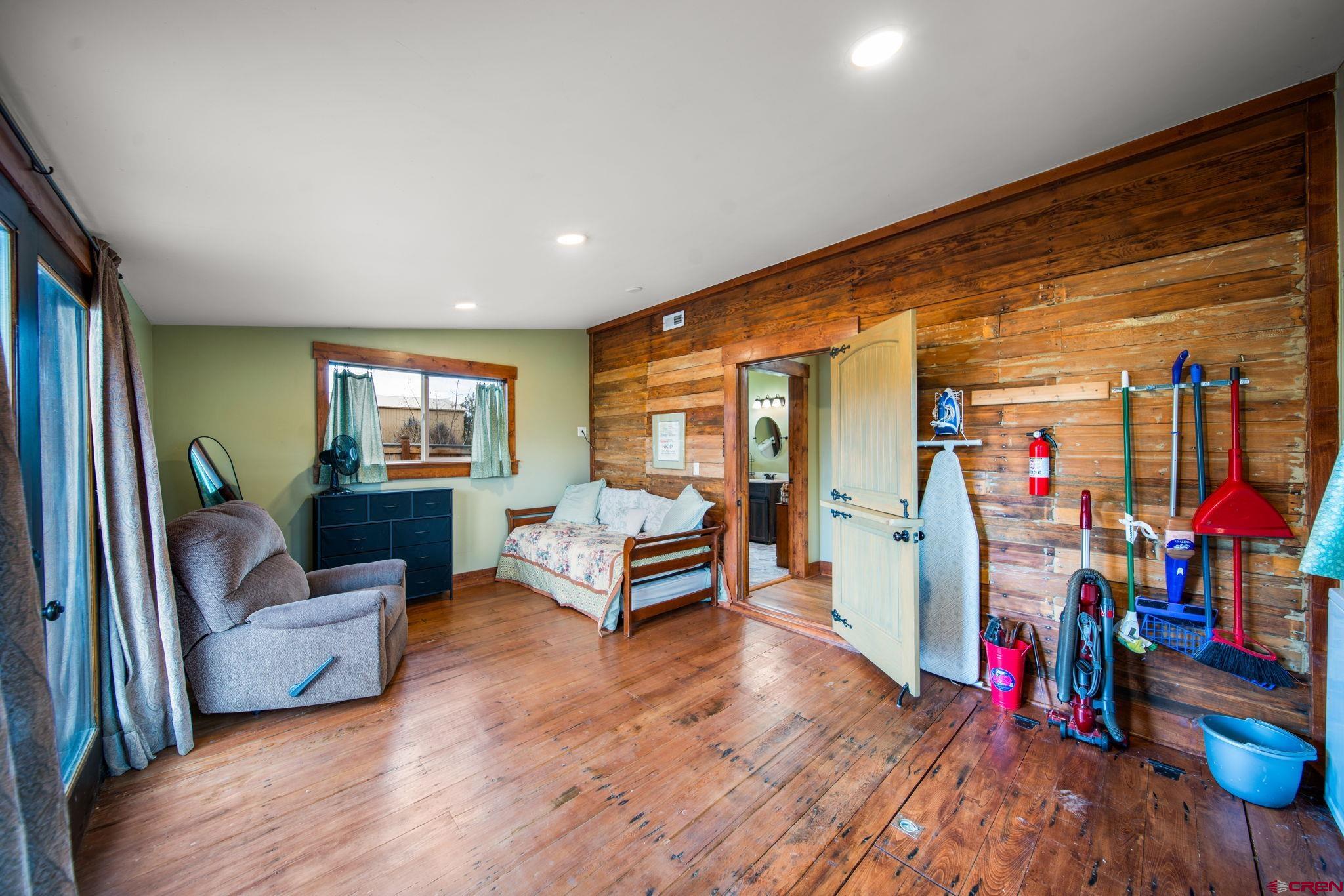 115 South Linden Street Cortez, CO 81321 - Photo 19 of 30 a living room with furniture and a wooden floor