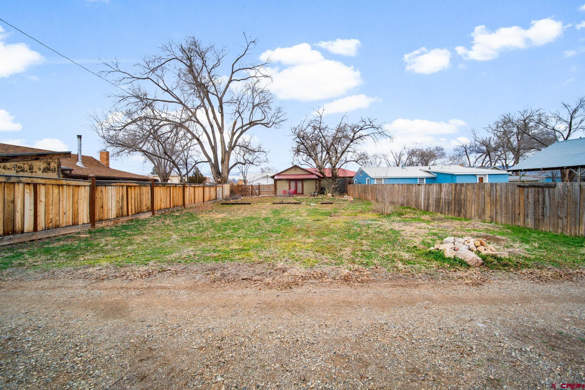 115 South Linden Street Cortez, CO 81321 - Photo 23 of 30 a view of a backyard with a garden