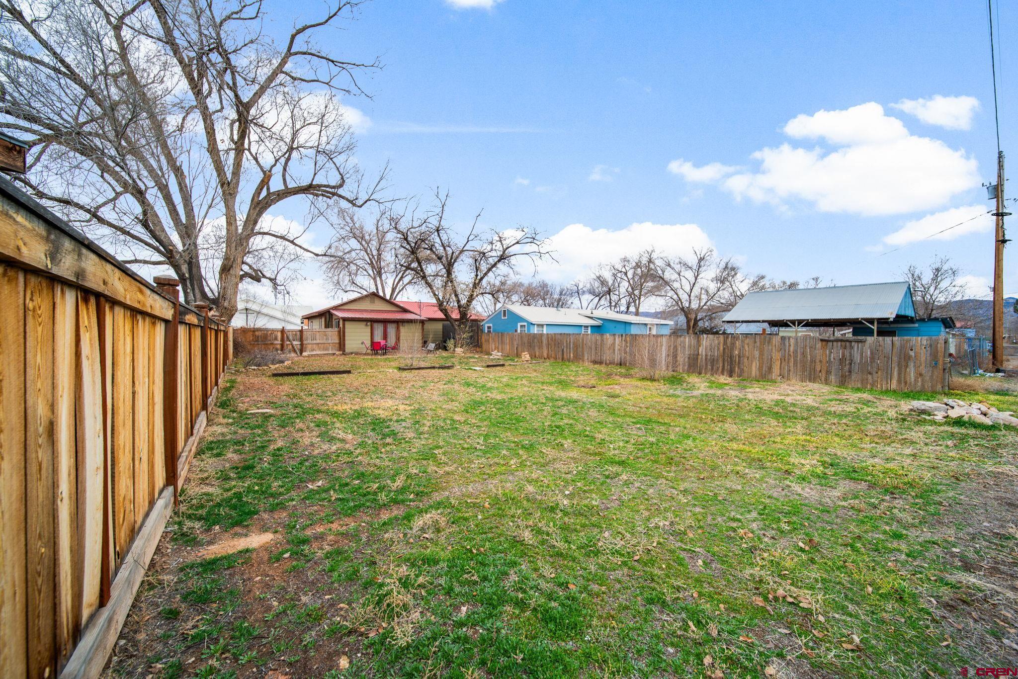 115 South Linden Street Cortez, CO 81321 - Photo 24 of 30 a view of a garden with a bench