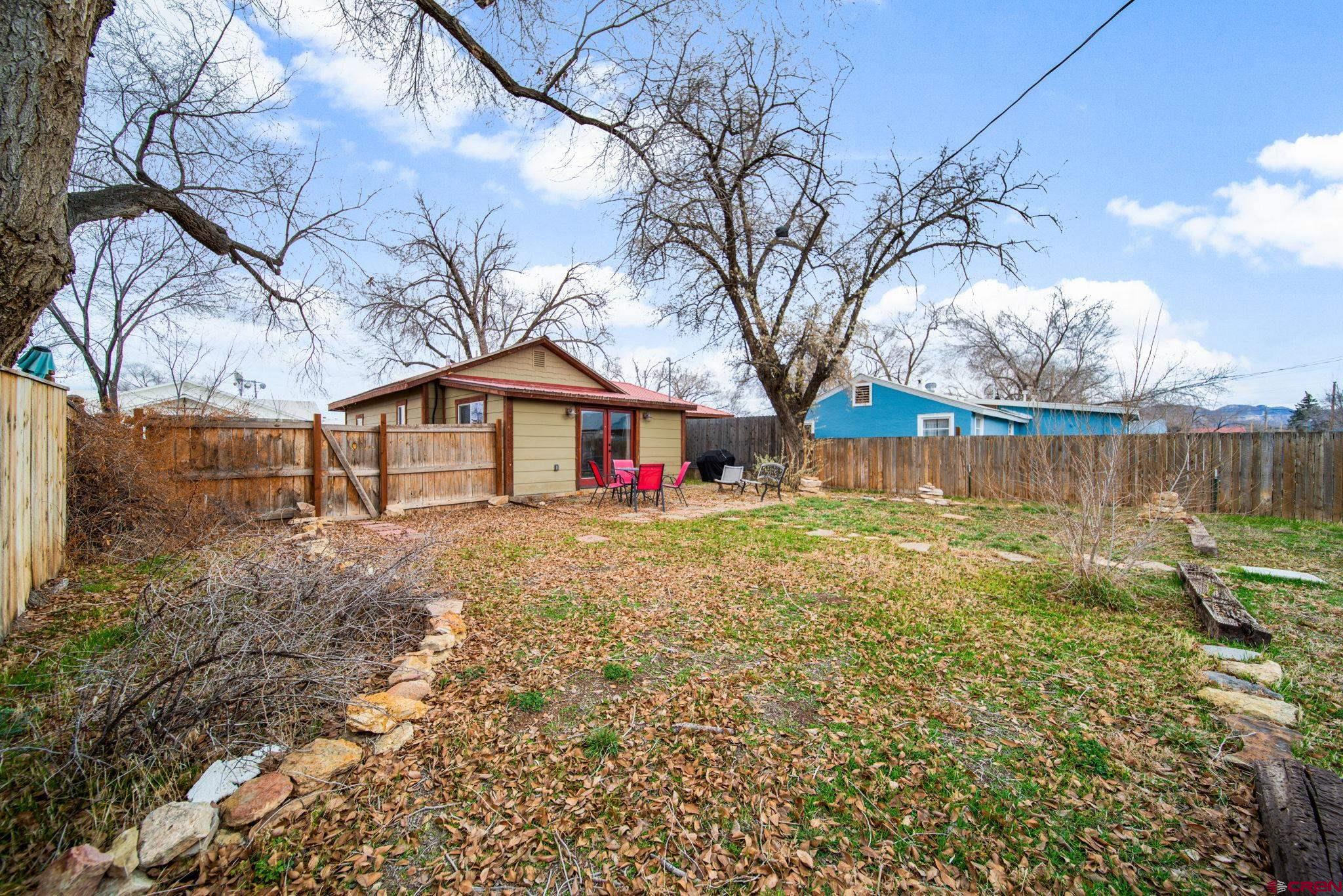 115 South Linden Street Cortez, CO 81321 - Photo 25 of 30 a backyard of a house with lots of green space