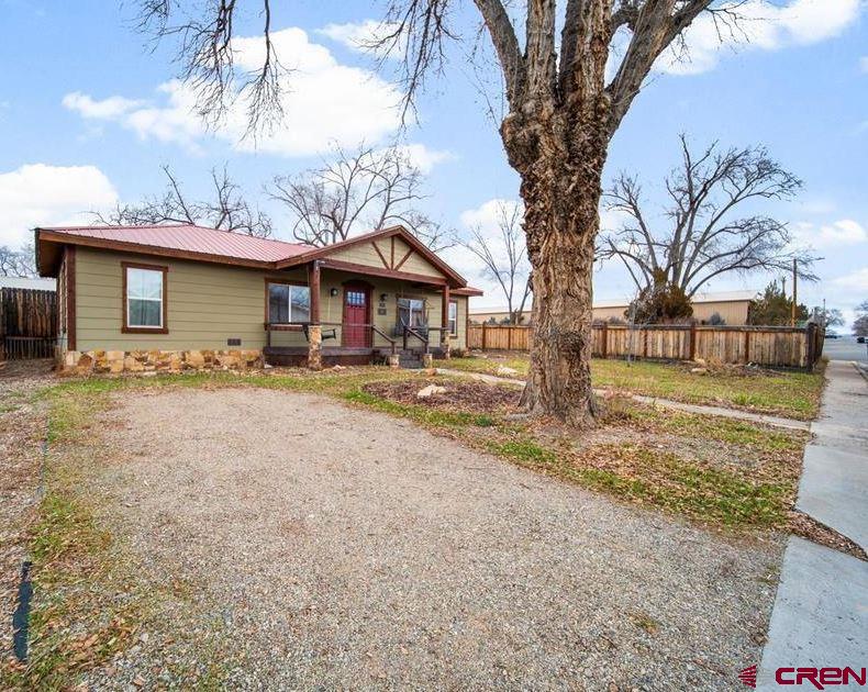 115 South Linden Street Cortez, CO 81321 - Photo 27 of 30 a front view of a house with a yard