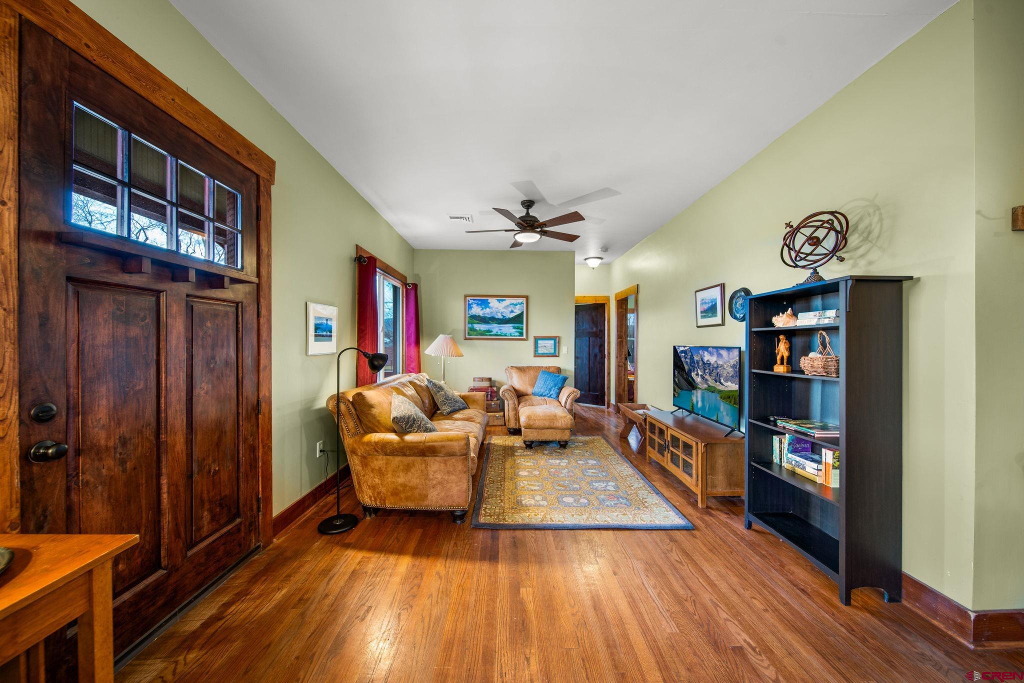115 South Linden Street Cortez, CO 81321 - Photo 5 of 30 a living room with furniture and a wooden floor