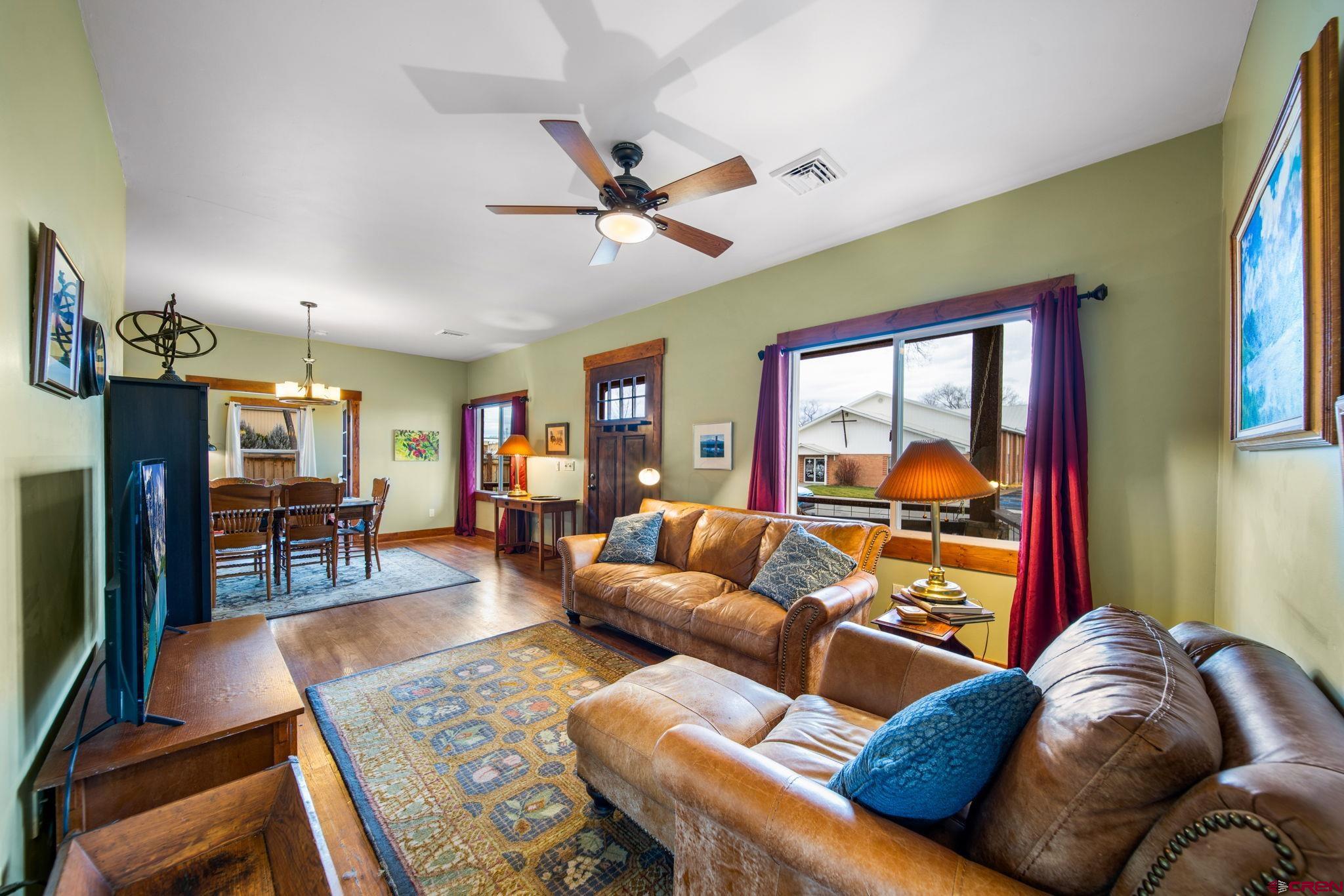 115 South Linden Street Cortez, CO 81321 - Photo 6 of 30 a living room with furniture and a flat screen tv