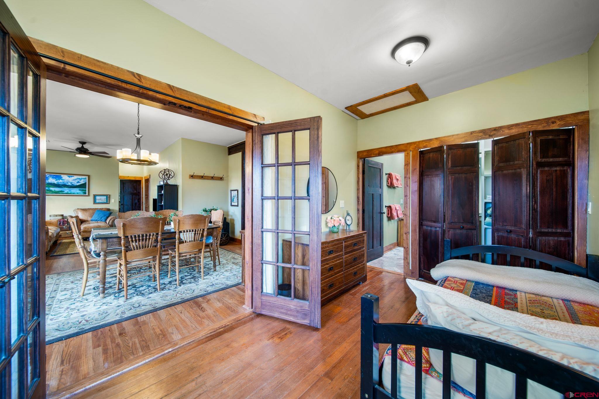 115 South Linden Street Cortez, CO 81321 - Photo 10 of 30 a dining room with furniture and a floor to ceiling window