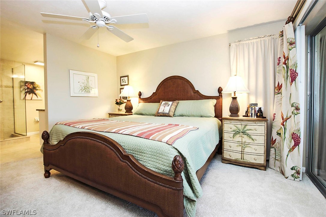 1133 Sand Castle Road Sanibel, FL 33957 - Photo 5 of 28 a bedroom with a bed and a painting on the wall