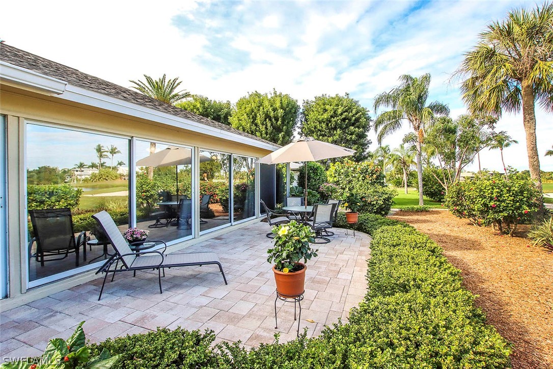 1133 Sand Castle Road Sanibel, FL 33957 - Photo 8 of 28 a house view with a seating space and garden view