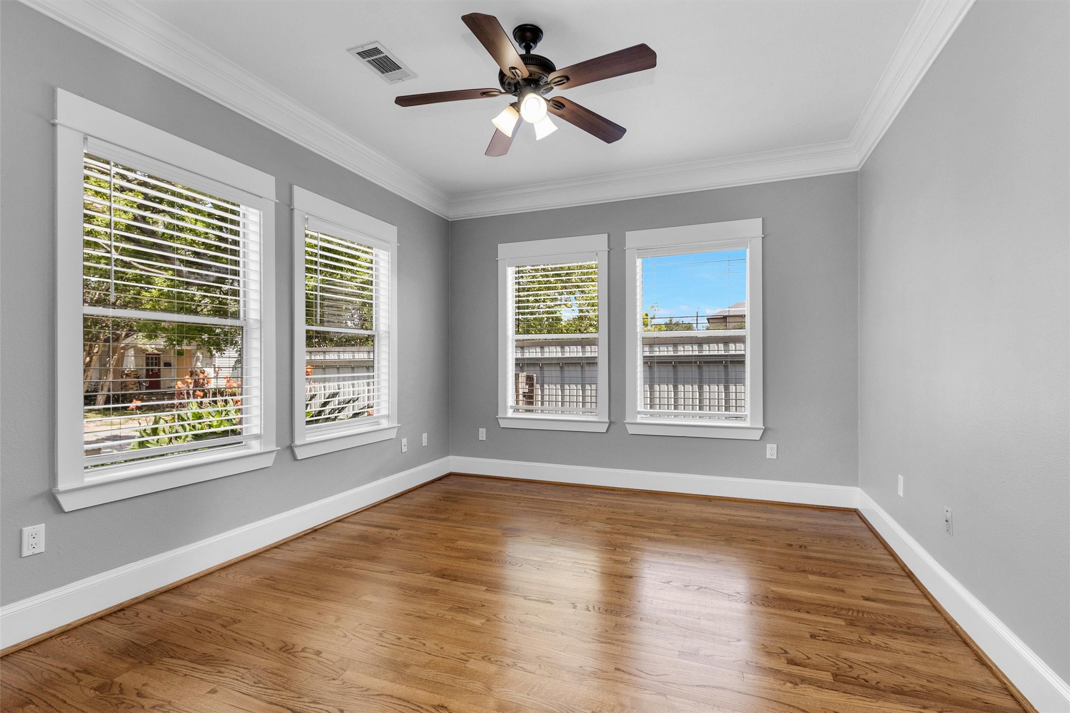 304 Vincent Street Houston, TX 77009 - Photo 16 of 36 a view of an empty room with wooden floor and a window